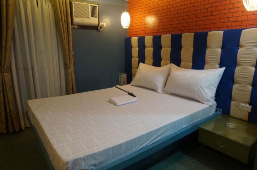 Hotel Icon Manila Zimmer foto