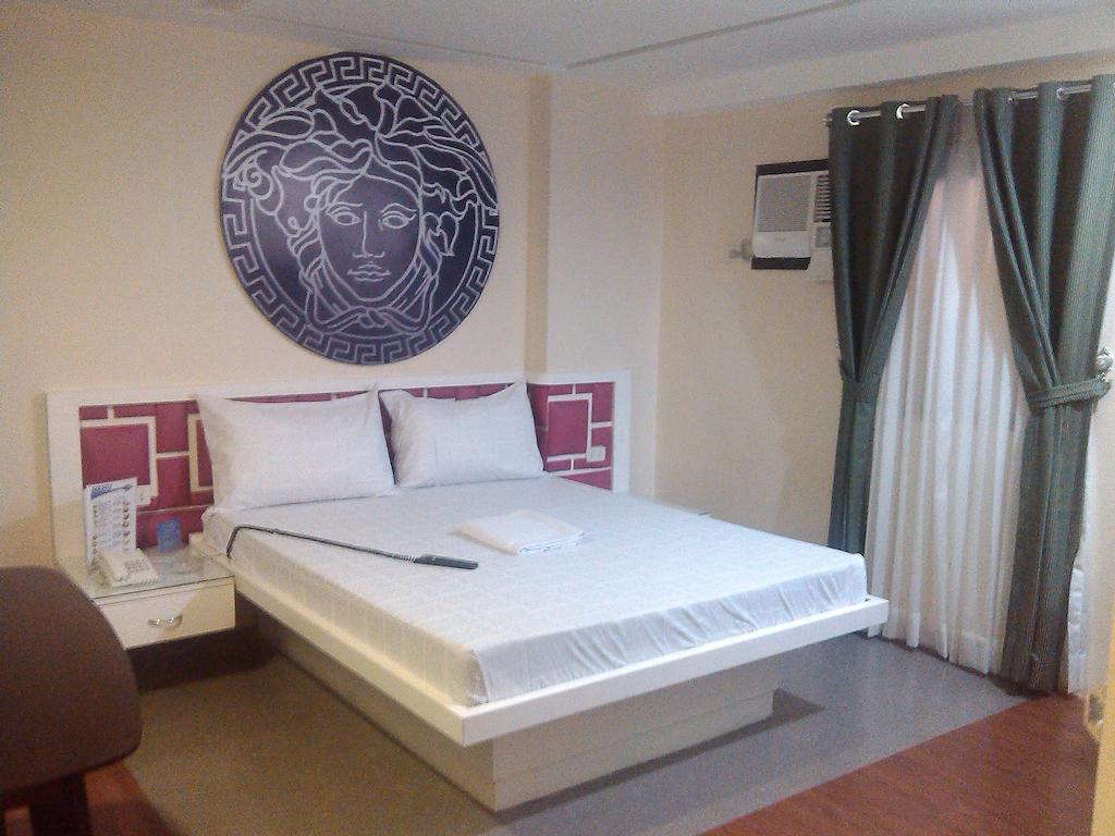 Hotel Icon Manila Zimmer foto